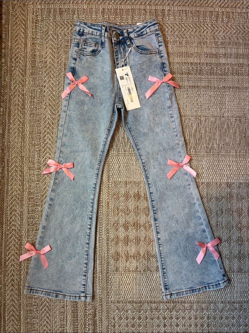 Light Wash Jeans with Pink Bow Accents - girls